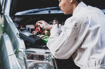 car-repairman-wearing-white-uniform-standing-holding-wrench-that-is-essential-tool-mechanic