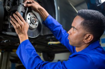 mechanic-fixing-car-brake